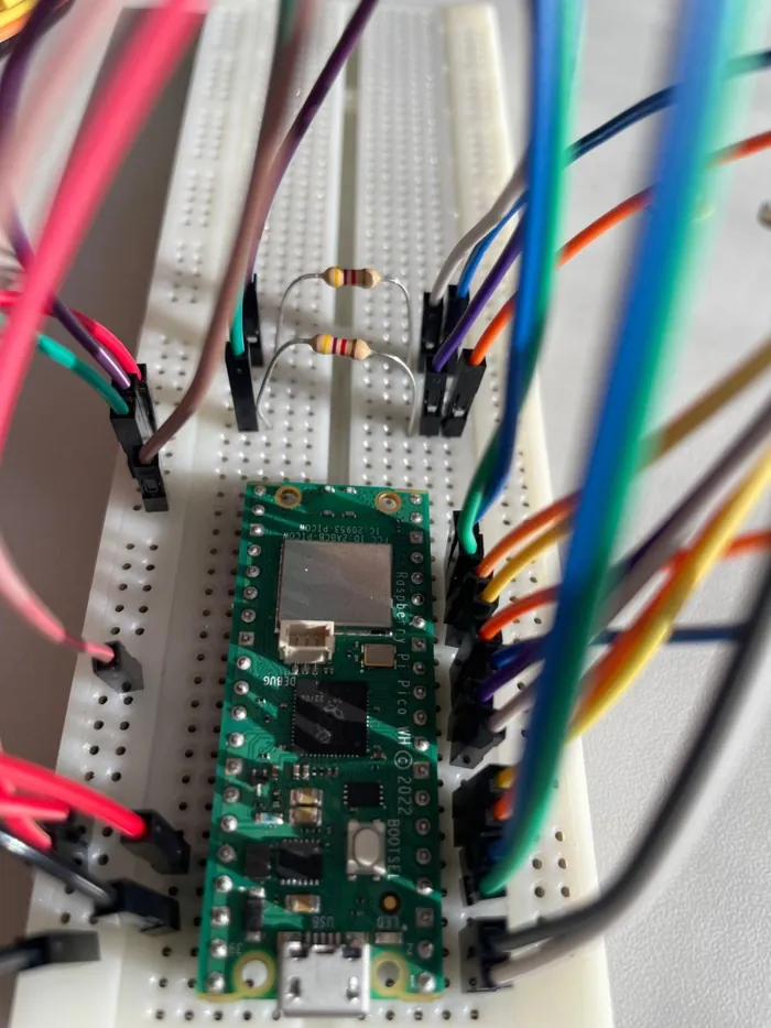Raspberry Pi Pico W wired to the camera on a breadboard